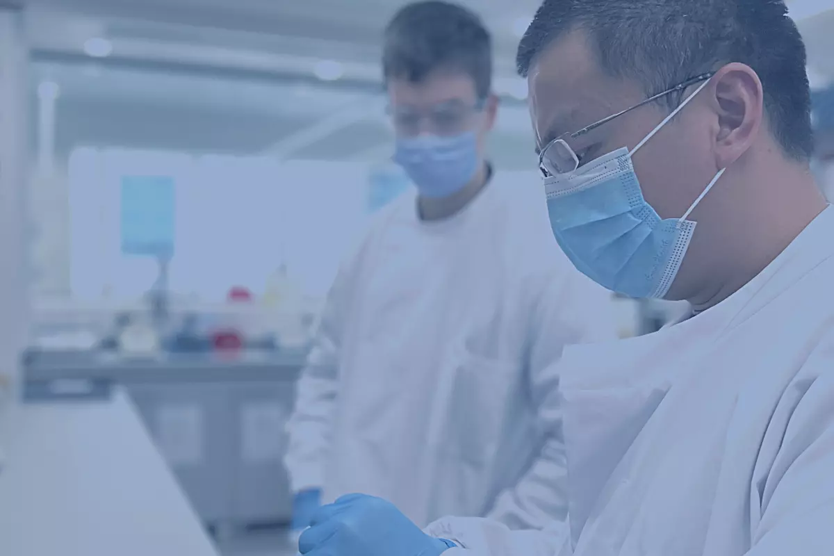 Banner image showing two scientists working together